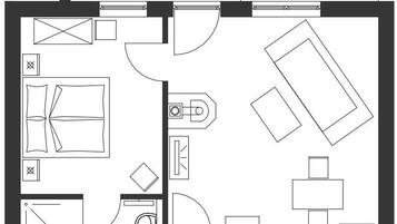Ein Grundriss mit Terrasse, Bad, Küche und Essbereich.