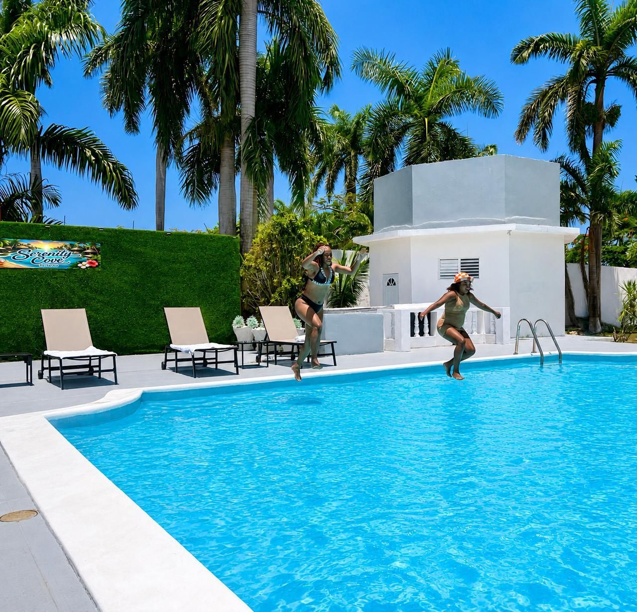 A swimming pool with lounge chairs and palm trees in the background.