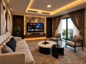 A modern living room with a flat-screen TV, comfortable seating, and a view to the outdoors. - Vesta Luxury APT - 2Br - cfc xc (New Cairo)