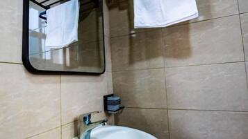 Slippers, towels, soap, toilet paper