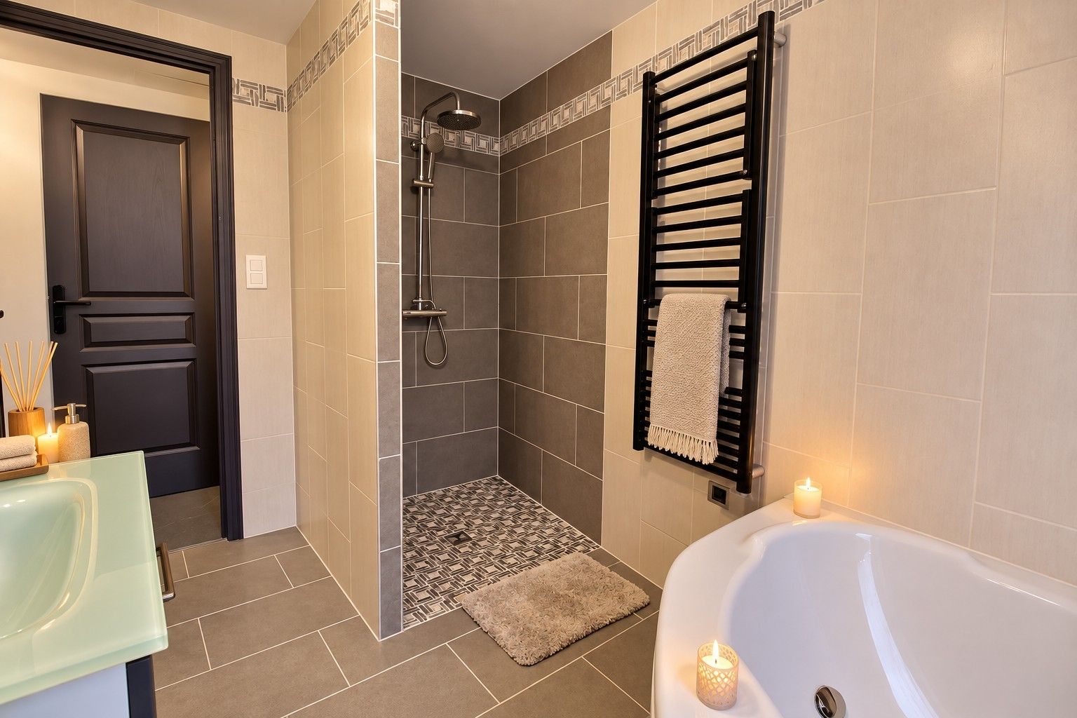 A modern bathroom with a shower, a bathtub, and a towel rack.