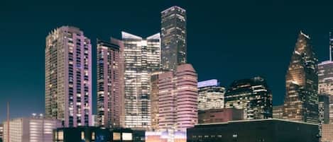 A nighttime cityscape with high-rise buildings.