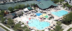 A resort with multiple swimming pools, a tennis court, and a variety of outdoor seating areas. - Coastal Fun at Bayside Resort | Near the Beach (Selbyville)