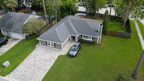 A residential property with a garage, a driveway, and a lawn. - Two Private Jacksonville Studios Near Hospitals (Jacksonville)
