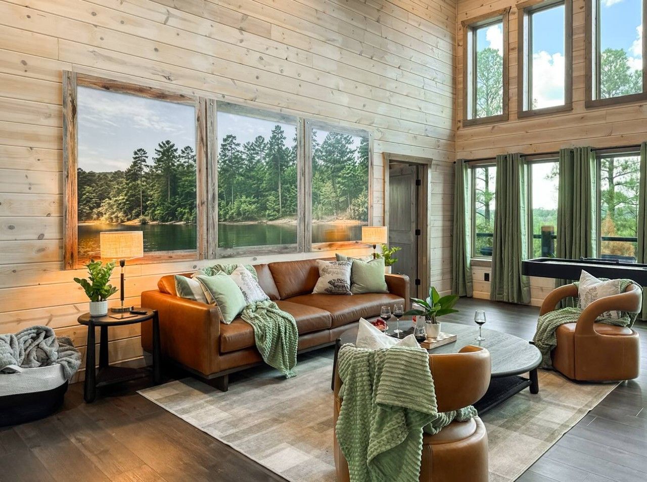 A cozy living room with a brown leather sofa, a coffee table, and a fireplace.