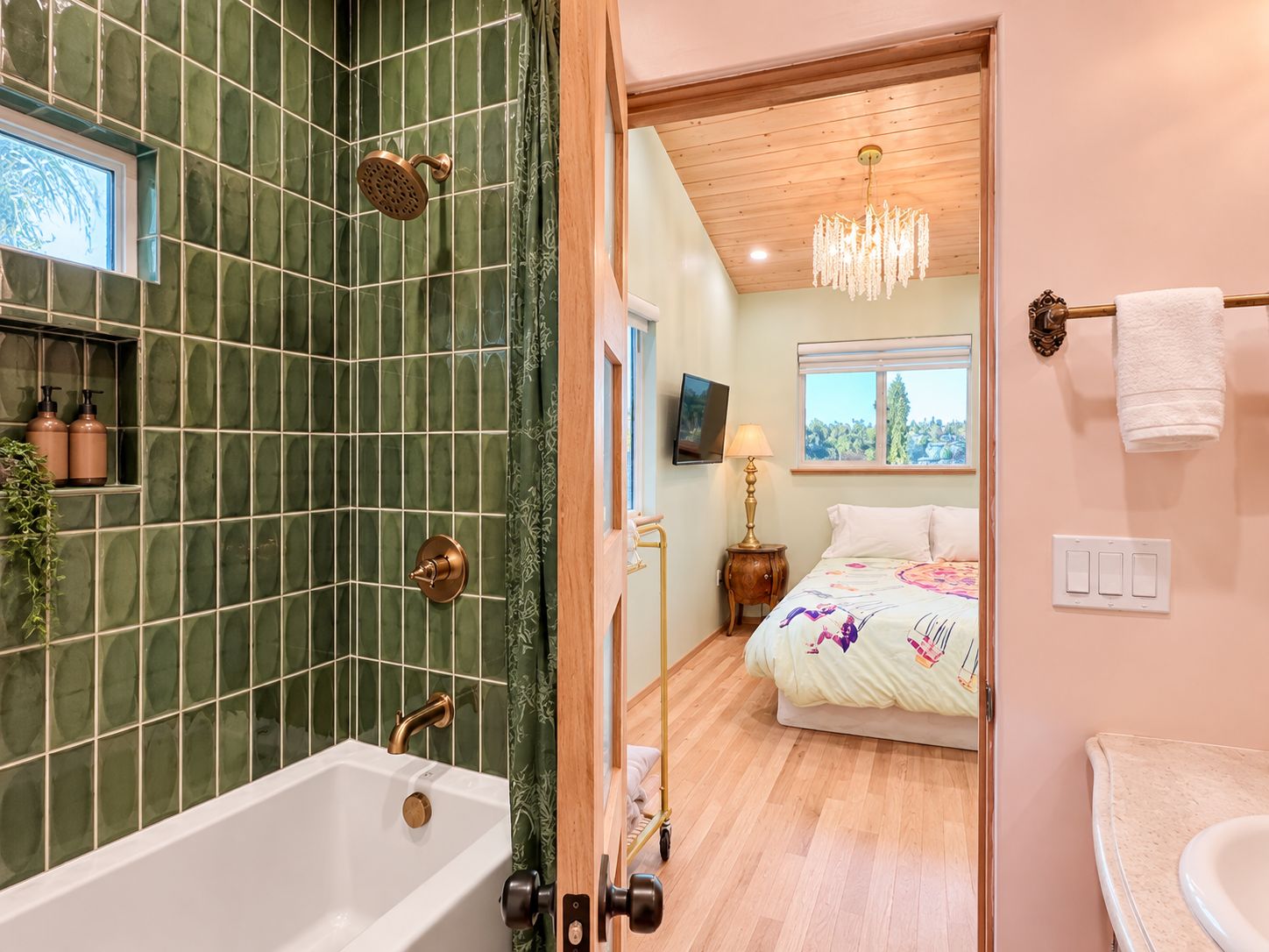 A bathroom with a bathtub, shower, and a toilet.