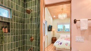 A bathroom with a bathtub, shower, and a toilet. - 
The Perch  2BR Eagle Rock Home + Views near DTLA (Los Angeles)