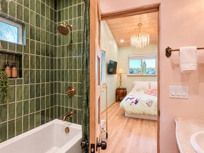 A bathroom with a bathtub, shower, and a toilet. - 
The Perch  2BR Eagle Rock Home + Views near DTLA (Los Angeles)