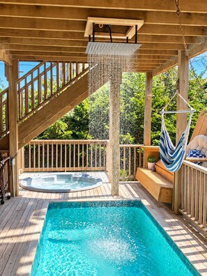 A wooden deck with a hot tub, a hanging hammock, and a pool. - Gatsby’s OBP, 3rd House to the Beach, Heated Pool + 2 Hot Tubs, Sleeps 24 (Ocean Bay Park)