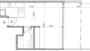 A floor plan with a kitchen, a bathroom, and a living area.