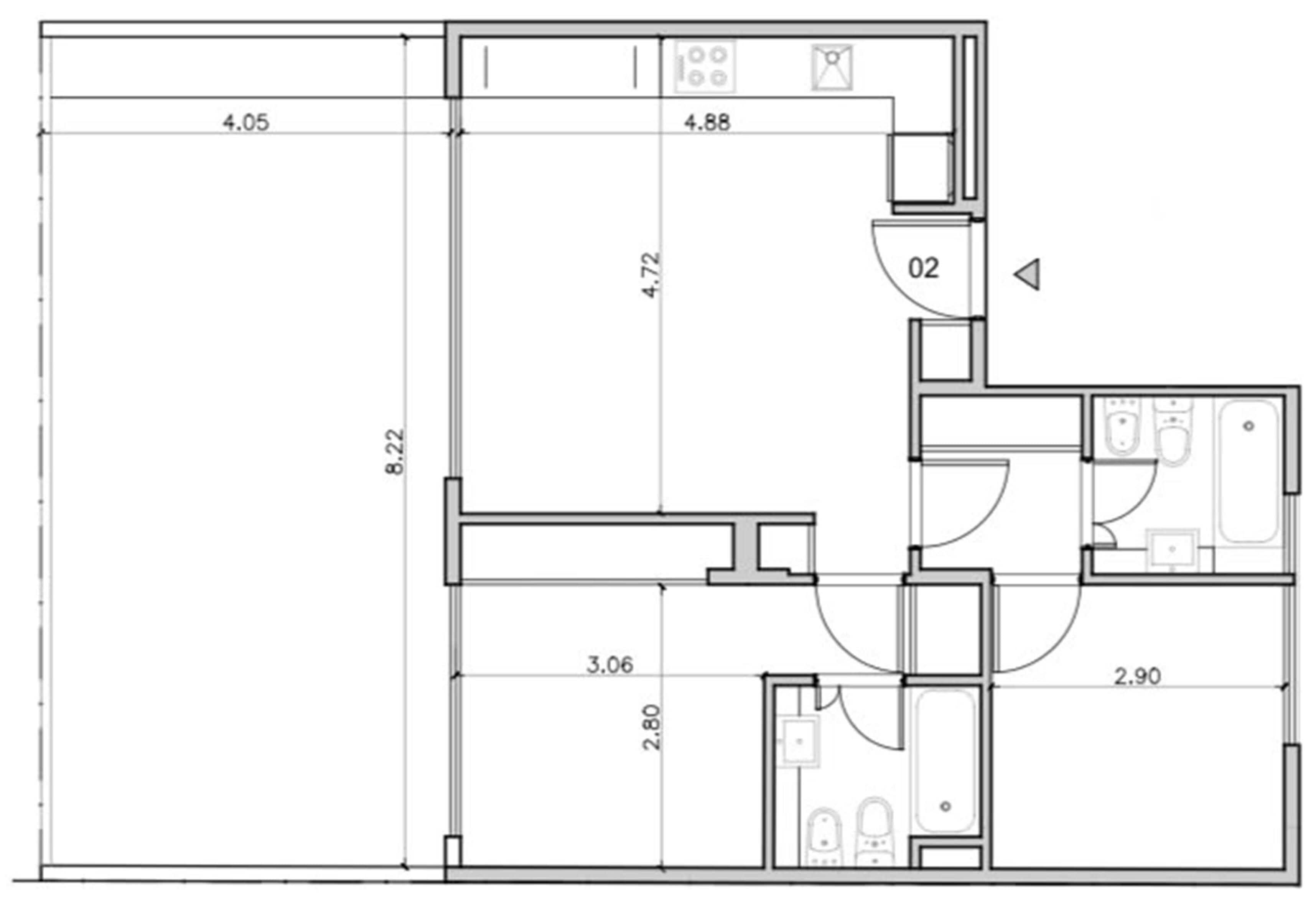 A floor plan with a bedroom, bathroom, and kitchenette.