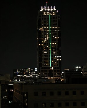 A high-rise building with multiple illuminated windows at night. - Sandton Westpoint Luxury Apartments 191 (Sandton)