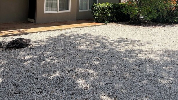 A two-story building with a balcony, a gravel driveway, and a sign that reads 'Casa Nimbu'. - Private Tropical Villa • Pool • Near Conchal & Flamingo (Brasilito)