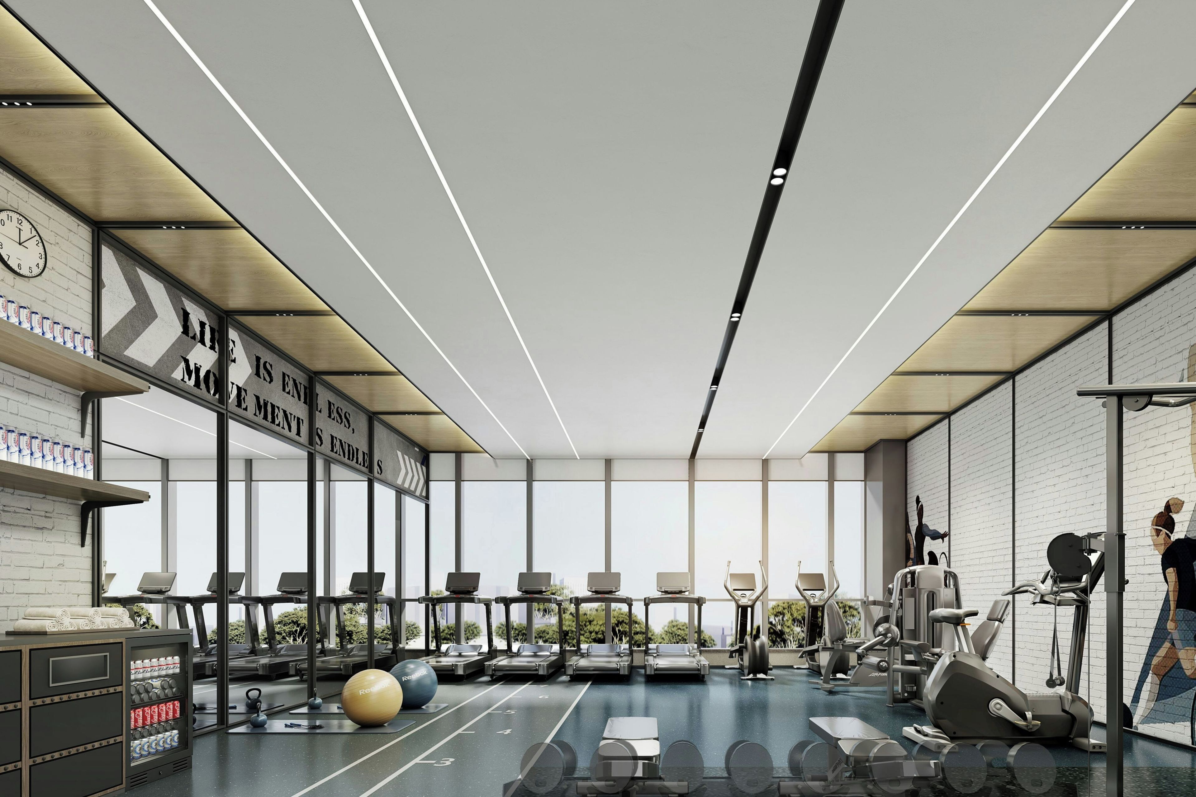 Een moderne sportschool met fitnessapparatuur, een klok en inspirerende muurdecoratie.