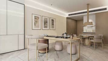 A modern kitchen with a dining area, featuring a marble floor, a central island, and a wall-mounted stove.
