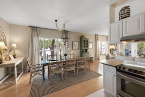 A spacious kitchen with a dining area, large windows, and a modern oven. - No crowds!!!! Private deeded beach…South side of 30a! No streets to cross!! BIG! (Santa Rosa Beach)