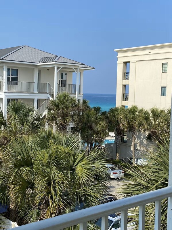 A beachfront property with a two-story building, a pool area, and palm trees. - No crowds!!!! Private deeded beach…South side of 30a! No streets to cross!! BIG! (Santa Rosa Beach)