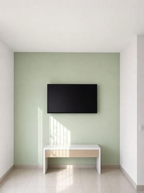 A room with a flat-screen TV mounted on a light green wall, a white bench, and a tiled floor. - Vacation home in Araruama, near the lagoon. (Araruama)