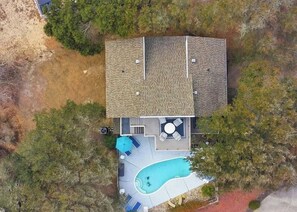 An aerial view of a house with a swimming pool, patio furniture, and a deck. - Welcome to your ultimate coastal escape! 2min walk to a private beach (Kitty Hawk)
