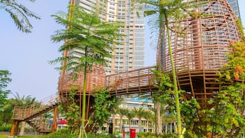 A modern building with a unique cylindrical structure and a spiral staircase.