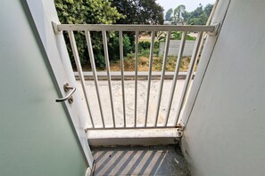 A gated entrance with a metal gate and a door handle. - Good And Practical Studio Room At Apartment Sudimara Forestwalk (Tangerang)