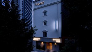 A building with a sign reading 'Anook Hotel' and 'The Coziest Hotel on Earth.' - Anook Hotel Daegu Station (Daegu)