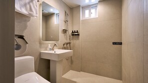 A modern bathroom with a sink, mirror, and shower. - Anook Hotel Daegu Station (Daegu)