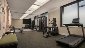 A gym with various exercise equipment, including treadmills and weight machines. - Wanda Yi Sayram Lake (Bole)