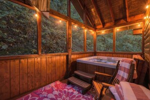 A wooden cabin with a hot tub, a bench, and a table. - 2Mi to Pkway|Hot Tub|Newly Renovated|LUXE Cabin (Pigeon Forge)