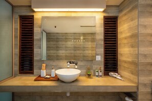 A modern bathroom with a large mirror, wooden paneling, and a central sink. - Spacious 6-bedroom hotel in amazing Bentota with AC (Bentota)