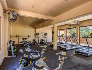 A gym with stationary bikes, treadmills, and weightlifting equipment. - Luxury 2BR Penthouse in the Jungle. Nature, Pools & Cenotes in Tulum (Tulum)
