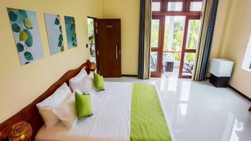 A hotel room with a bed, a wardrobe, a television, and a view of the outdoors.