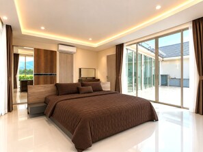 Ein modernes Schlafzimmer mit einem großen Bett, einem Flachbildfernseher und einer Schiebetür zum Balkon.