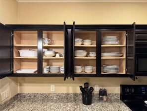 A kitchen with wooden cabinets, granite countertops, and a built-in microwave. - 3 Bedrooms - 3 Bathrooms, 7 min to Texas A&M (College Station)