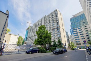 A multi-story residential building with a modern design, featuring balconies and large windows. - Warsaw | Pereca 2 | Comfortable Apartment | City Centre (Warszawa)