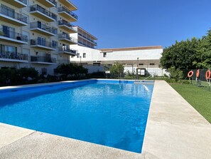 A swimming pool with a clear blue water surface, surrounded by a concrete deck. - Holiday Home in Nerja With Sea Views (Nerja)