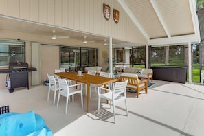 An outdoor patio with a dining table, chairs, a grill, and a sofa. - Private Pool! Family Escape, 11 Mi to Jensen Beach (Port St. Lucie)