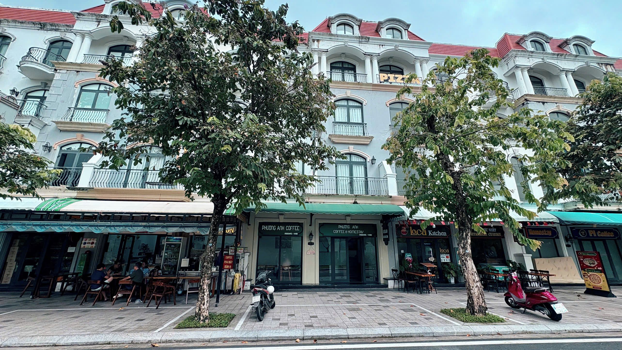 A building with a cafe and a coffee shop on the ground floor.