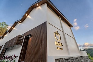 A modern building with a prominent logo and the name 'EALA ESTATE' on its facade. - Eala Estate (Pujut, Central Lombok Regency)