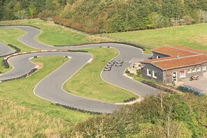 A winding road with a building on the right. - Holiday home in Goting with swimming pool (Goting)