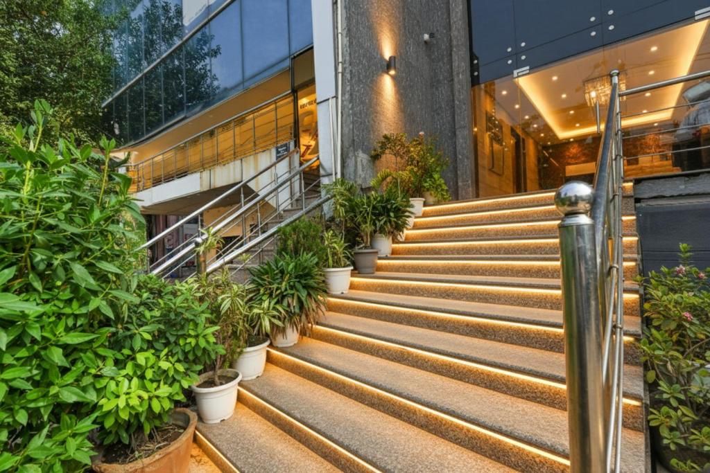 A set of outdoor stairs with a modern design, leading to a building entrance.