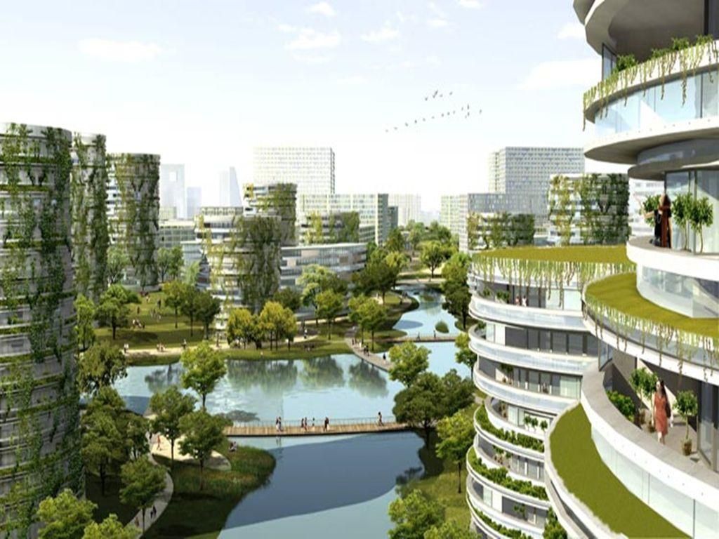 A modern urban residential area with high-rise buildings, green spaces, and a water body.