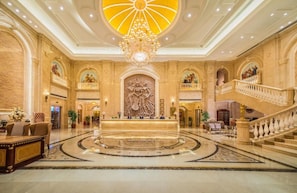 A grand lobby with a central reception desk, a large chandelier, and a grand staircase. - Vienna 3 Best Hotel (Tianjin)