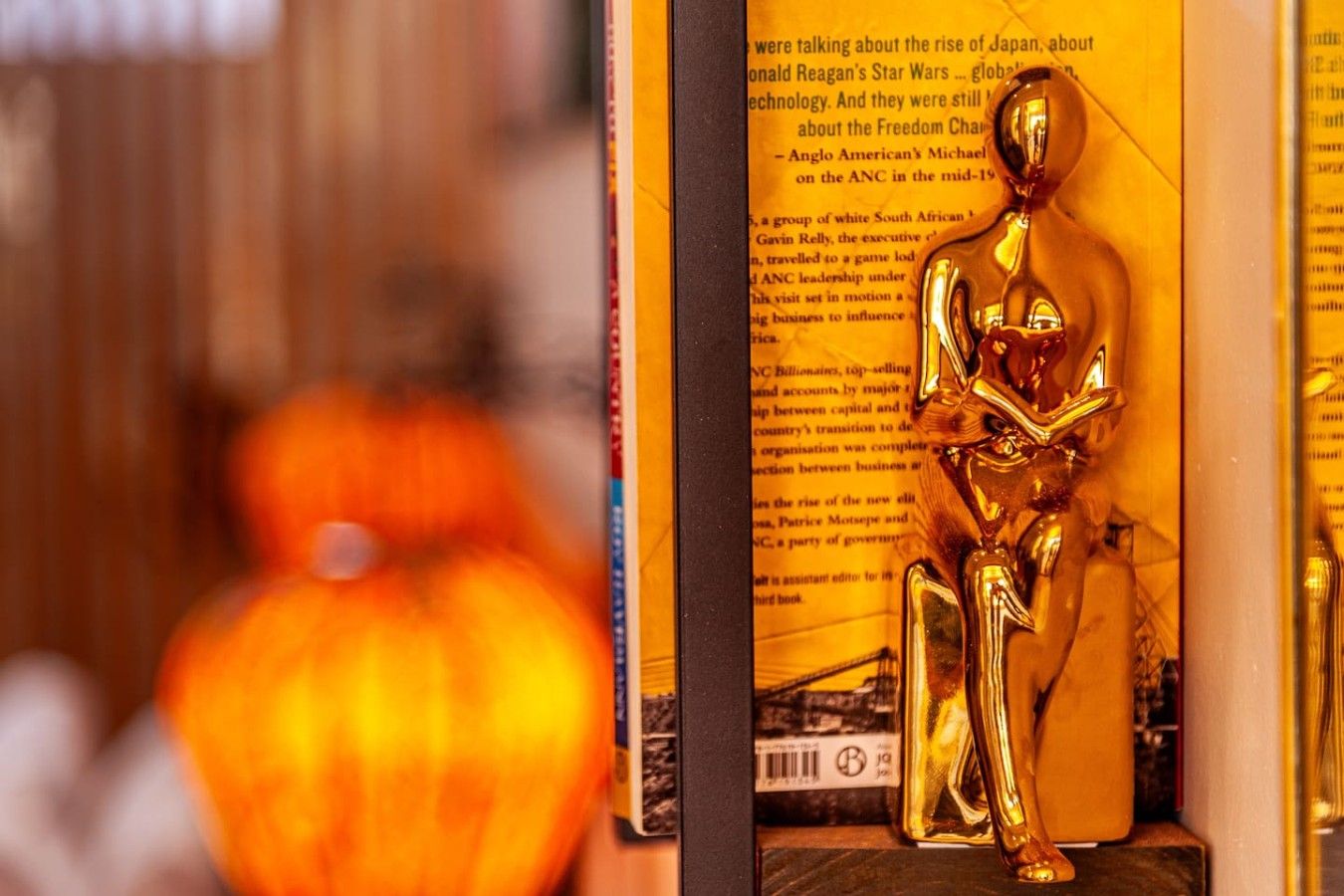 A book with a golden statue on its cover.