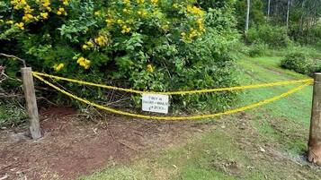 A fenced area with a sign indicating a 200-meter walking path.