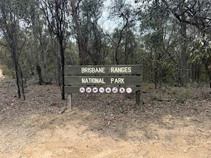 A wooden sign with 'BRISBANE RANGES NATIONAL PARK' written on it.