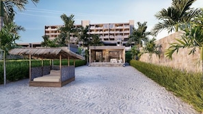A hotel with a beachfront view, a pool area, and a thatched-roof structure. - Shah Palace Zanzibar (Matemwe)