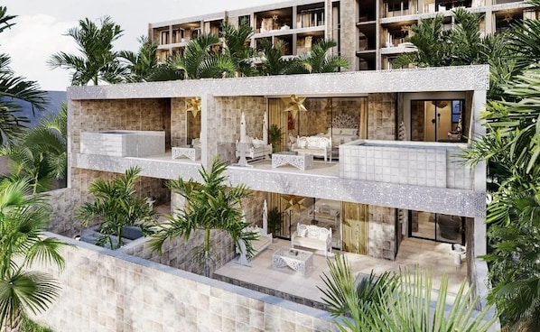 A multi-story hotel with balconies, outdoor seating, and lush greenery. - Shah Palace Zanzibar (Matemwe)