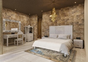 A bedroom with a large bed, a dresser, a vanity, and a mirror. - Shah Palace Zanzibar (Matemwe)