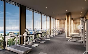 A gym with treadmills, elliptical machines, and weight equipment, with large windows overlooking a scenic view. - Shah Palace Zanzibar (Matemwe)